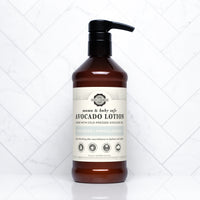 Showcases a bottle of Rustic Strength mama and baby safe unscented avocado lotion for sensitive skin.
