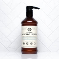 Rustic Strength displays their unscented, hypoallergenic face and body avocado lotion on a white marble surface.