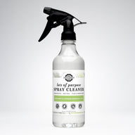 Inspect a clear spray bottle of plant-based, non-toxic Rustic Strength all-purpose cleaner featuring bergamot and cypress essential oils.