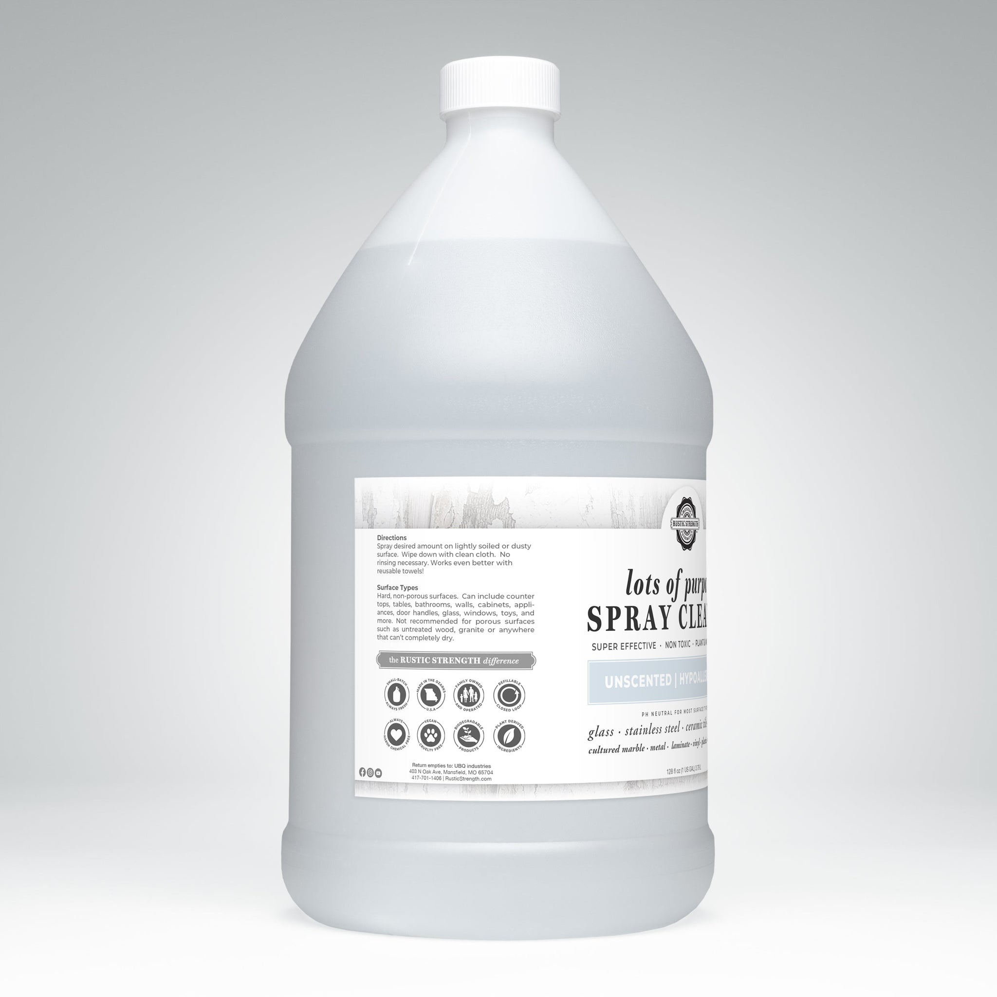 A gallon jug of Rustic Strength Spray Cleaner advertises its plant-based, unscented formula.
