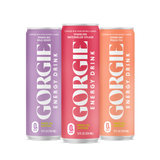 Three colorful Gorgie energy drink cans showcase wild berry, watermelon splash, and peach tea flavors.
