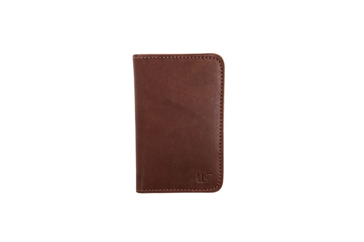 Showcases a brown leather wallet with subtle stitching details and a small embossed logo.
