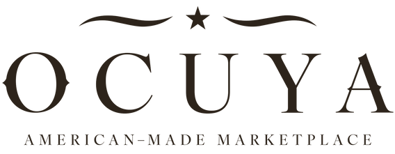 The logo for 'OCUYA American-Made Marketplace' features the brand name 'OCUYA' in a large, elegant serif font with decorative flourishes and a star above, and 'AMERICAN-MADE MARKETPLACE' in a smaller sans-serif font below, all in dark brown on a solid white background.