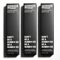 Three boxes of "Rhoid Rage" hemorrhoid ointment stand side-by-side, advertising its numbing and pain-relieving formula made in the USA.
