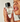 A woman holds the Jack Henry Frequency fragrance bottle up to her nose.

