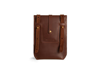 Showcases a handcrafted dark brown leather belt pouch featuring adjustable straps and brass button closure, ideal for everyday carry.
