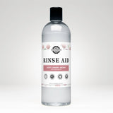 Rustic Strength Rinse Aid bottle showcases light cherry aroma, promising sparkling clean dishes without spots.
