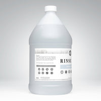 Rustic Strength presents a bottle of their eco-friendly, hypoallergenic Rinse Aid for sparkling, spot-free dishes.
