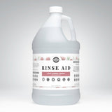 A gallon jug displays Rustic Strength Rinse Aid, highlighting its light cherry aroma and essential oil formula.
