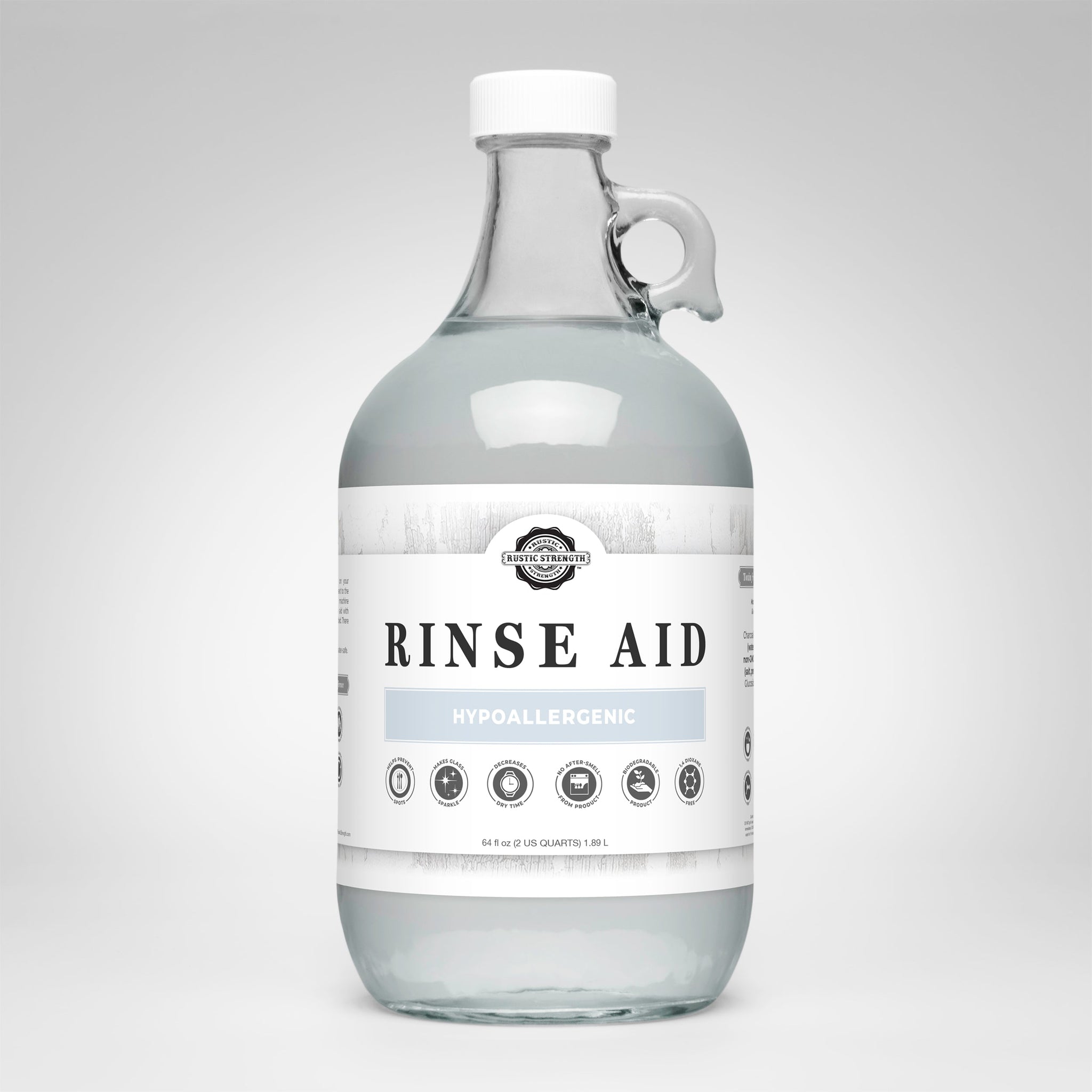 A glass jug displays Rustic Strength Rinse Aid, advertising its hypoallergenic and biodegradable formula for sparkling clean dishes.
