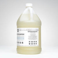A gallon jug displays Rustic Strength's hypoallergenic, toxin-free cleaning shampoo formulated for sensitive skin and hair.

