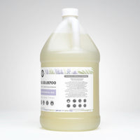 A large jug of Rustic Strength non-toxic tea tree shampoo promotes worry-free cleaning for sensitive skin and all hair types.
