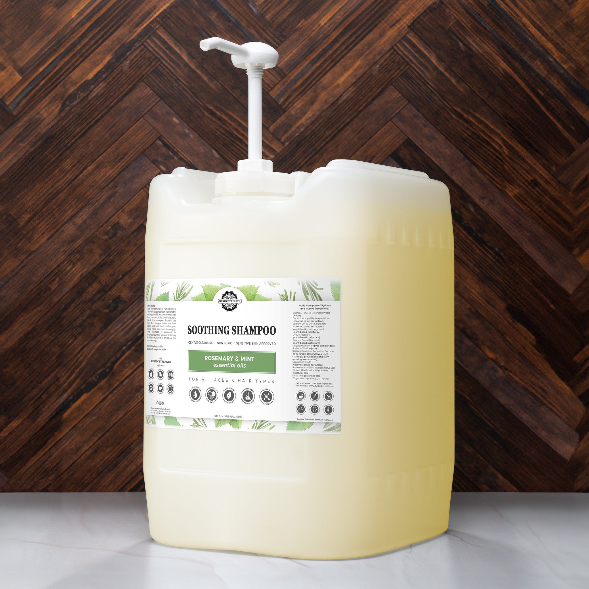 Rustic Strength showcases a large container of rosemary and mint soothing shampoo, designed for all ages and hair types, with a pump dispenser.