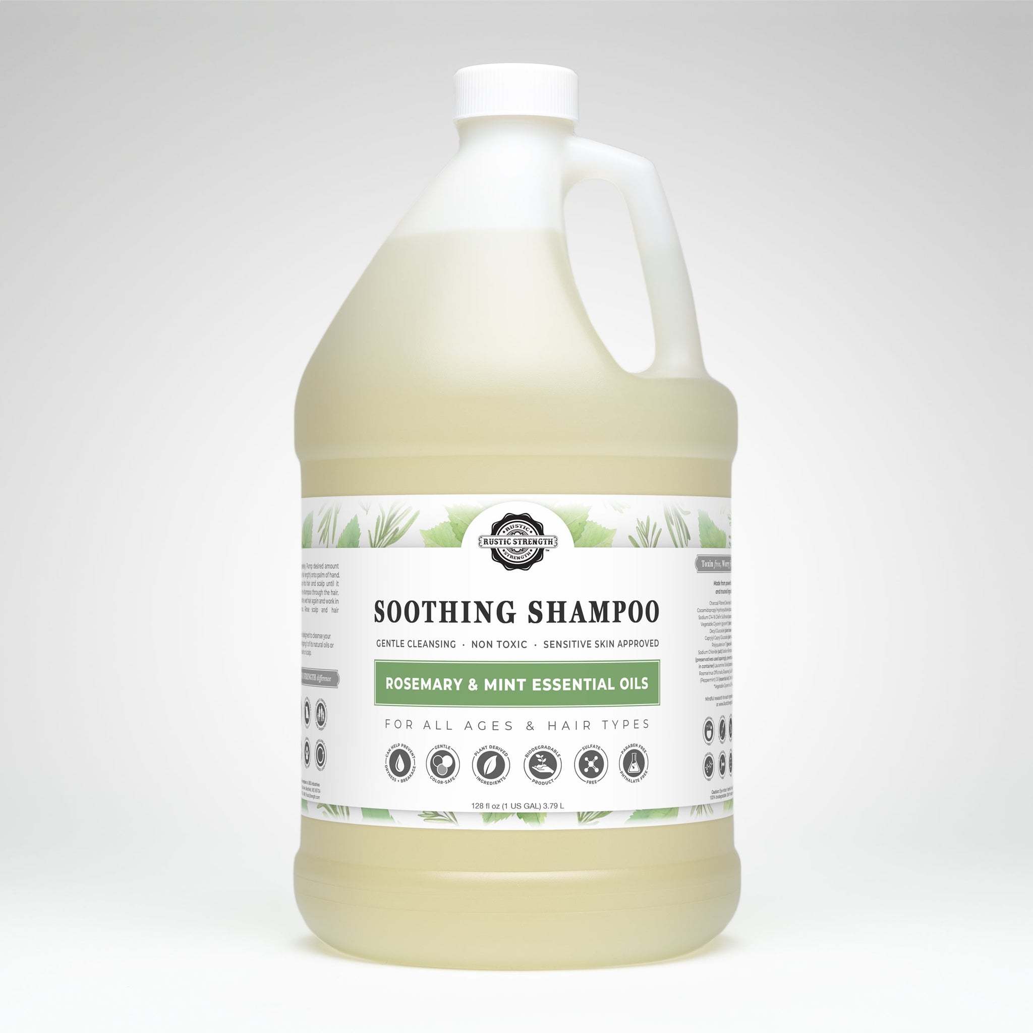 A gallon jug displays Rustic Strength Soothing Shampoo with rosemary and mint essential oils, designed for all ages and hair types.
