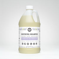 Showcases a large bottle of Rustic Strength Soothing Shampoo with lavender and tea tree essential oils for all ages and hair types.