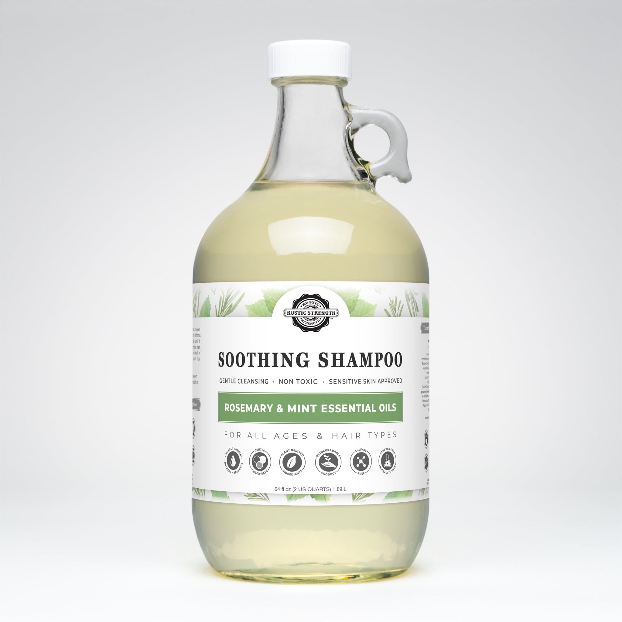 Rustic Strength's rosemary mint shampoo, in a glass jug, promises gentle cleansing with plant-derived ingredients suitable for all ages and hair types.