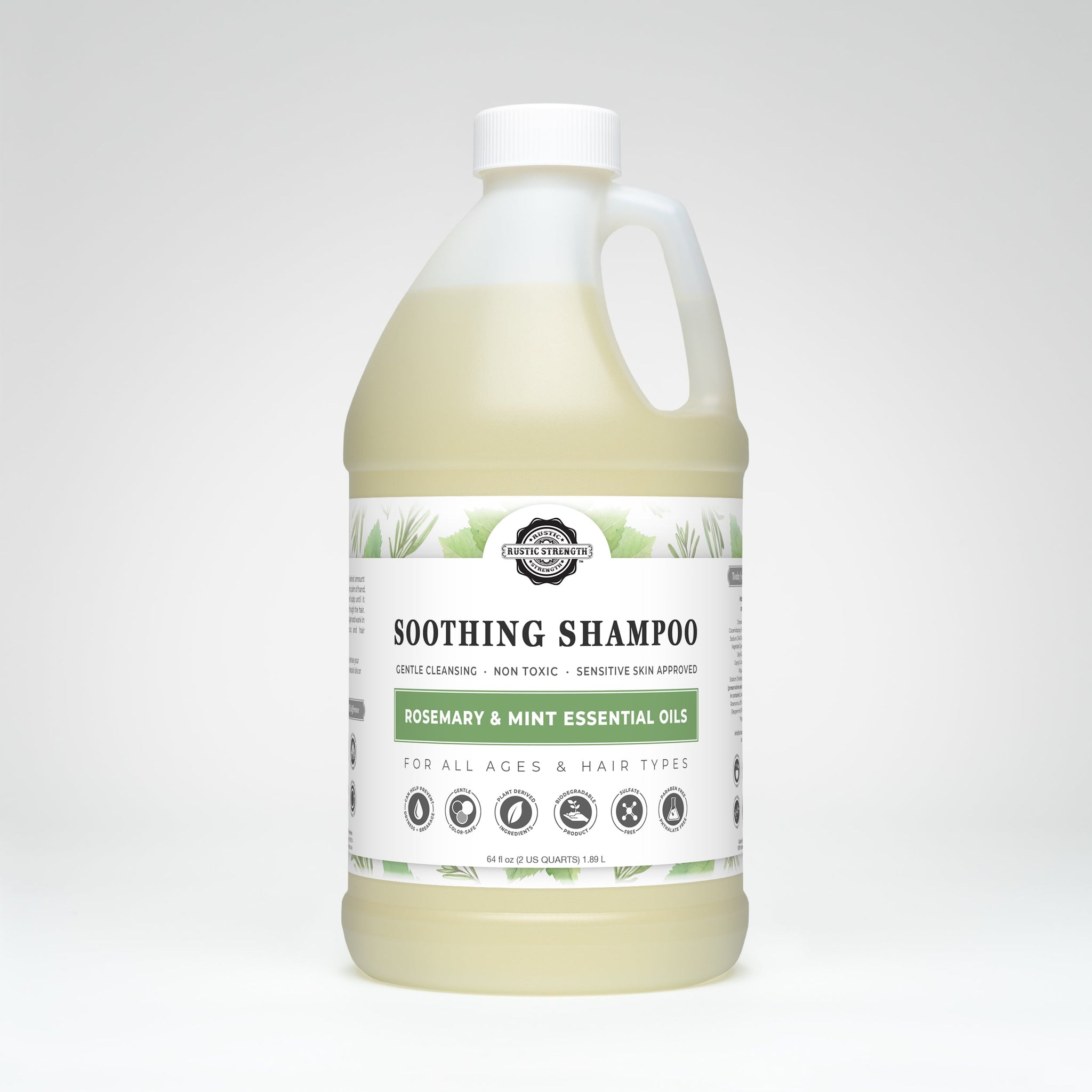 Display shows a bulk-sized bottle of Rustic Strength Soothing Shampoo with rosemary and mint essential oils, formulated for gentle cleansing and suitable for all ages and hair types.