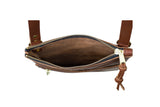A brown leather crossbody bag shows off its open zipper and spacious interior.
