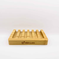 Green Llama displays their sustainable bamboo soap dish, promoting eco-friendly bathroom accessories.
