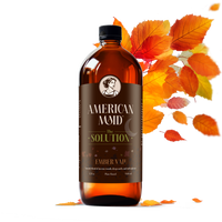 American Maid Ember Vale Solution displays in a glass bottle adorned with autumn leaves.
