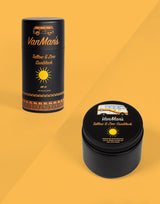 Two VanMan's Tallow & Zinc Sunblock products, a stick and a balm, sit against a yellow background.
