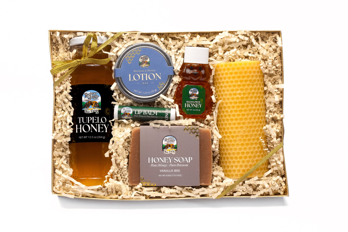 Showcase a Register Family Bee Farm gift box featuring tupelo honey, wildflower honey, honey lotion, honey soap, lip balm, and a beeswax candle.