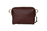 A brown leather crossbody bag with gold hardware sits on a white background.