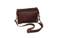 The stylish brown leather crossbody bag features gold hardware and an adjustable strap.
