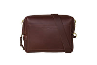 Showcases a stylish Urban Southern leather crossbody bag in rich brown.
