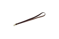 A brown leather wrist lanyard displays a gold-colored lobster claw clasp for attaching keys or other items.
