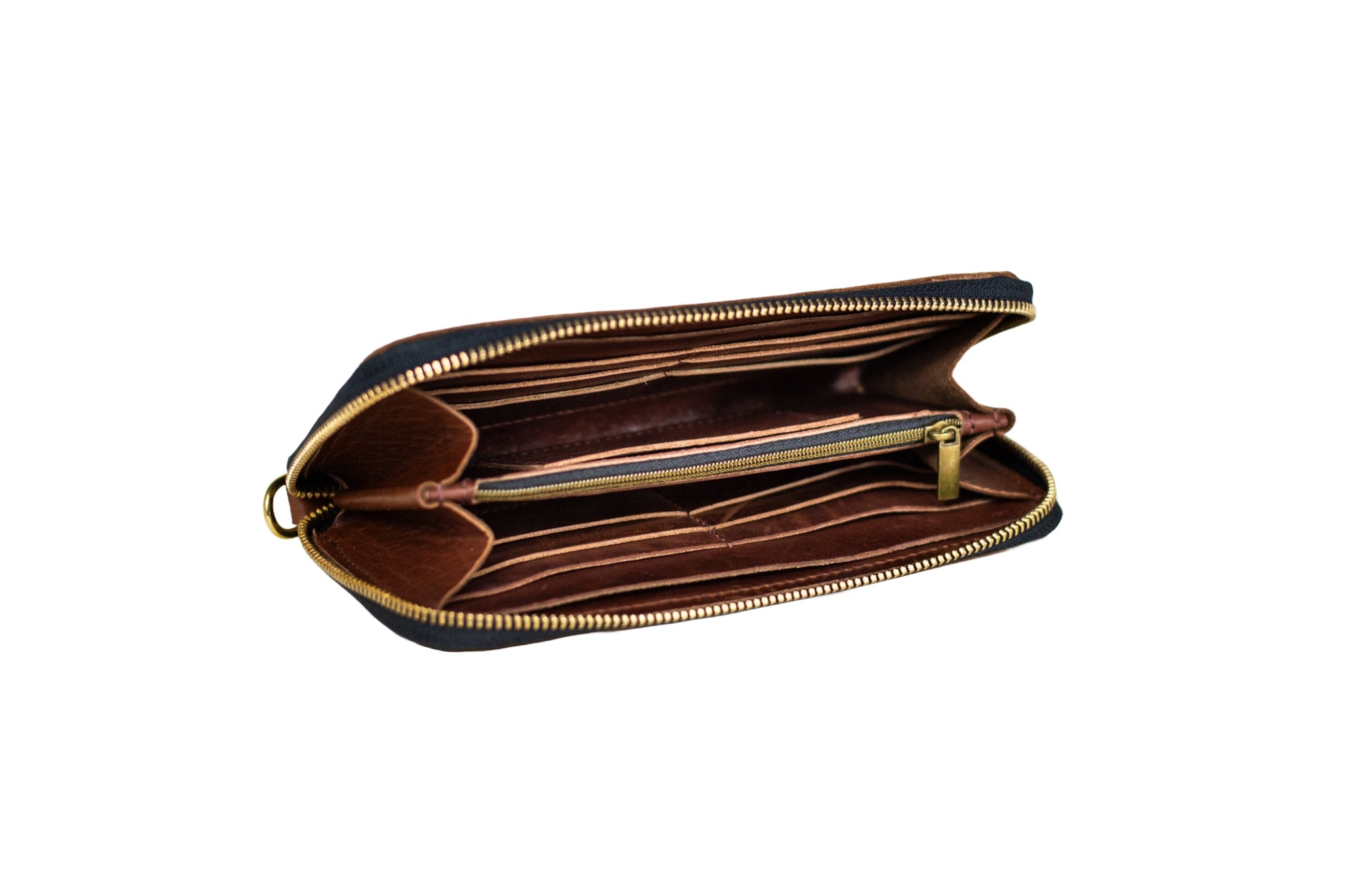 Open brown leather wallet showcases multiple card slots and a zippered compartment, highlighting its organizational features.

