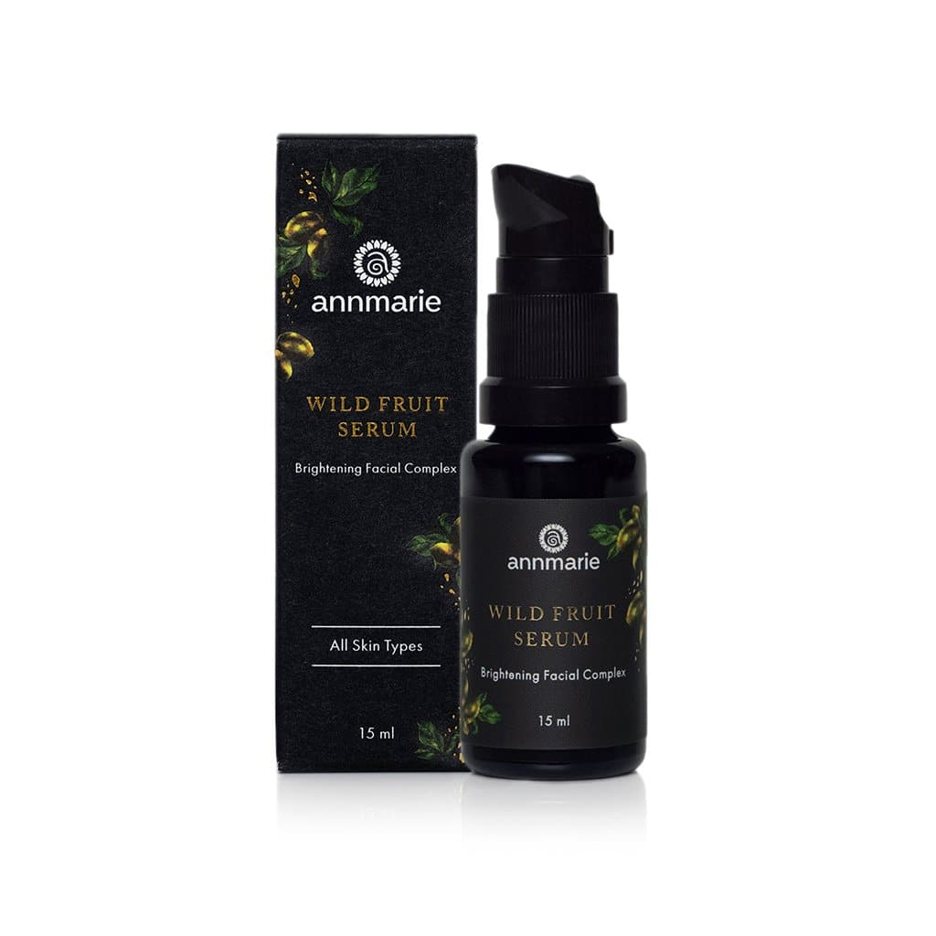 Annmarie Wild Fruit Serum bottle and box stand side-by-side, showcasing the brightening facial complex for all skin types.
