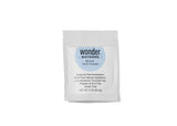 Shows a packet of Wonder Whitening Mineral Tooth Powder, boasting toxin-free natural ingredients and fluoride-free formula.
