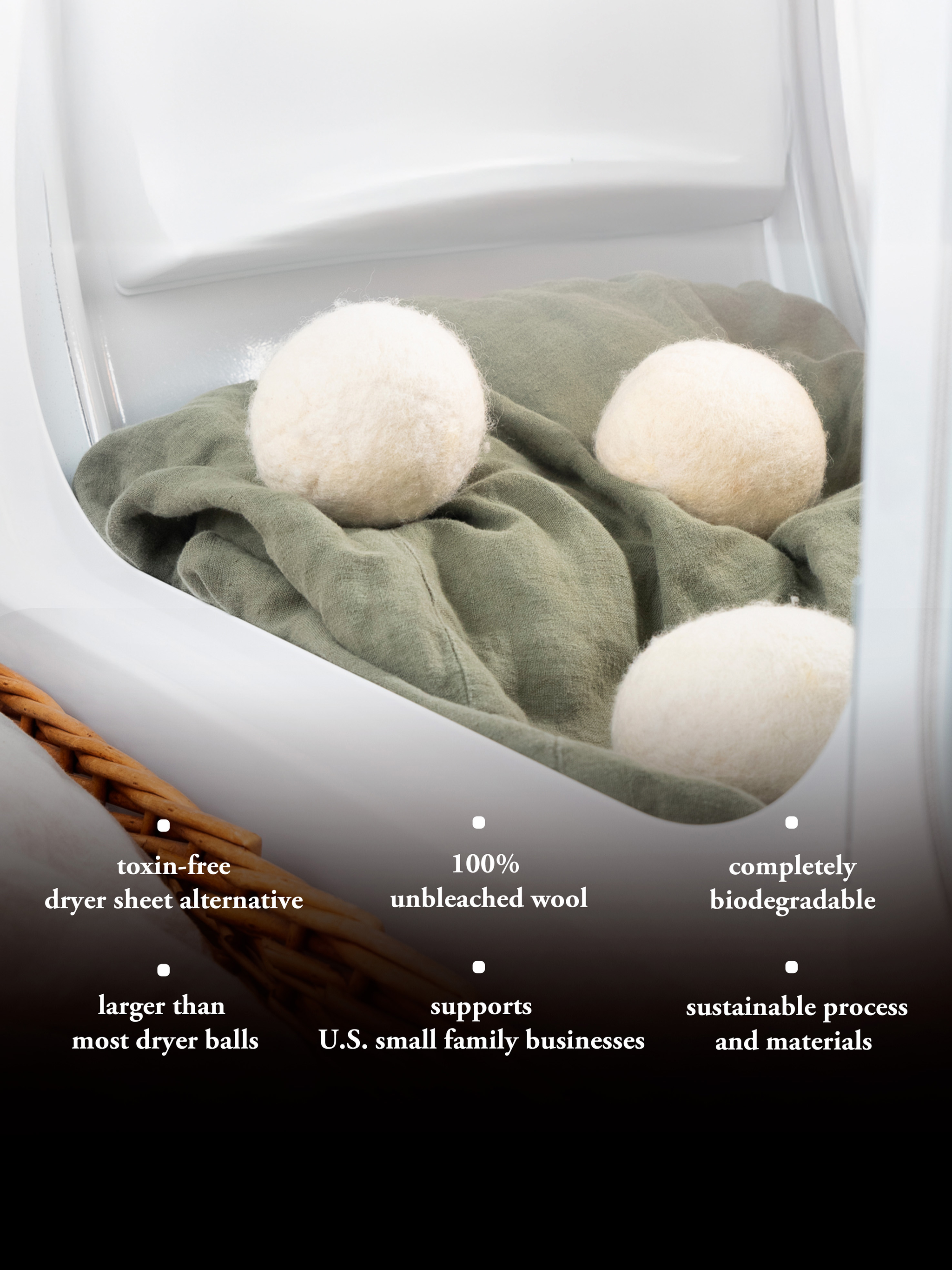 Inside a dryer, wool dryer balls sit atop a folded green linen sheet, offering an eco-friendly and sustainable laundry solution.
