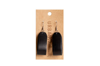 Urban Southern displays handmade black leather earrings on a branded cardboard earring card.
