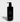 Jack Henry body wash displays in a sleek black bottle with a pump, highlighting its hinoki cypress scent for a luxurious cleanse.

