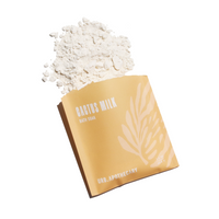URB.APOTHECARY Cactus Milk bath soak spills powder onto a white surface.
