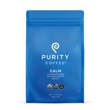 Purity Coffee's blue bag features Calm decaffeinated whole bean coffee, promising serenity with its USDA organic and bird-friendly blend.

