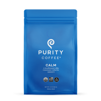 Purity Coffee's blue bag features Calm decaffeinated whole bean coffee, promising serenity with its USDA organic and bird-friendly blend.
