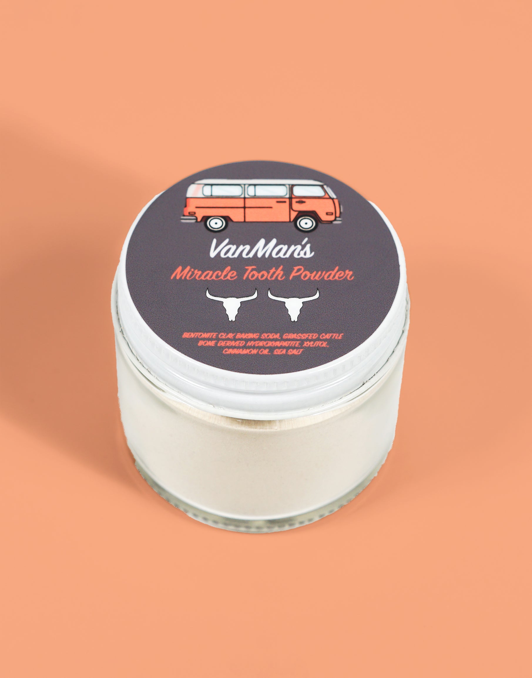 VanMan's Miracle Tooth Powder in a jar promises natural teeth cleaning with bentonite clay, baking soda, and grass-fed cattle bone derived hydroxyapatite.

