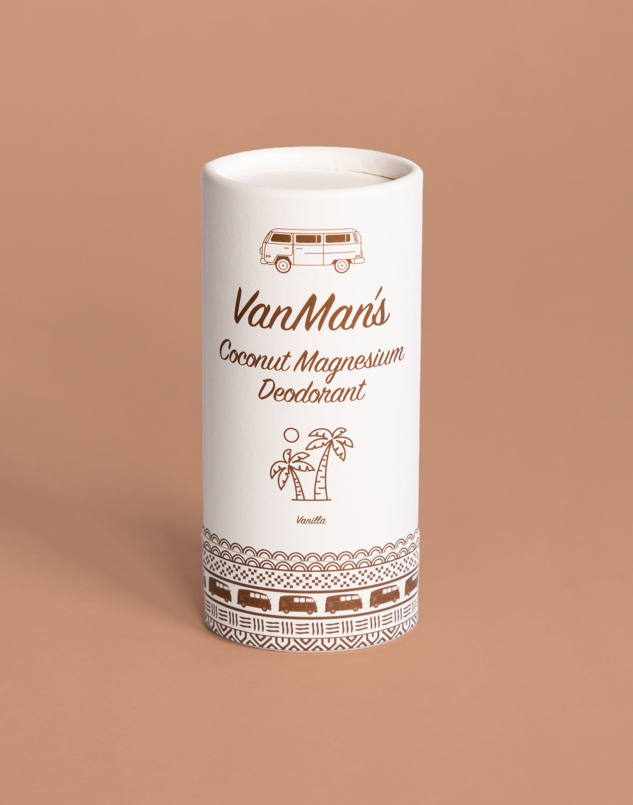 A white tube of VanMan's Coconut Magnesium Vanilla Deodorant displays camper van and palm tree illustrations against a tan background.
