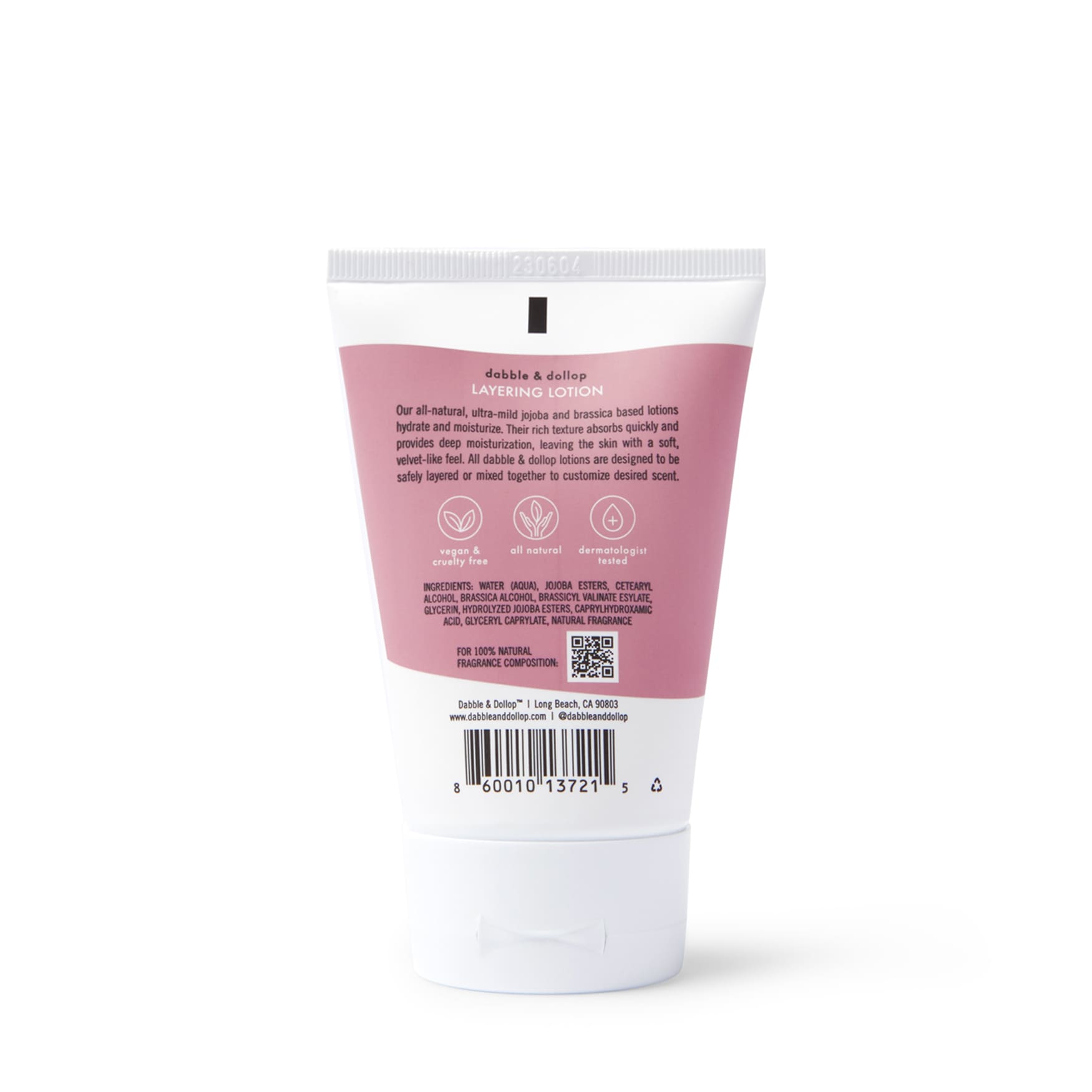 Examine Dabble & Dollop Layering Lotion bottle revealing its natural, vegan, and cruelty-free moisturizing ingredients.