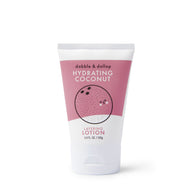 Dabble & Dollop sells hydrating coconut layering lotion in a white tube with a cartoon coconut on the pink label.
