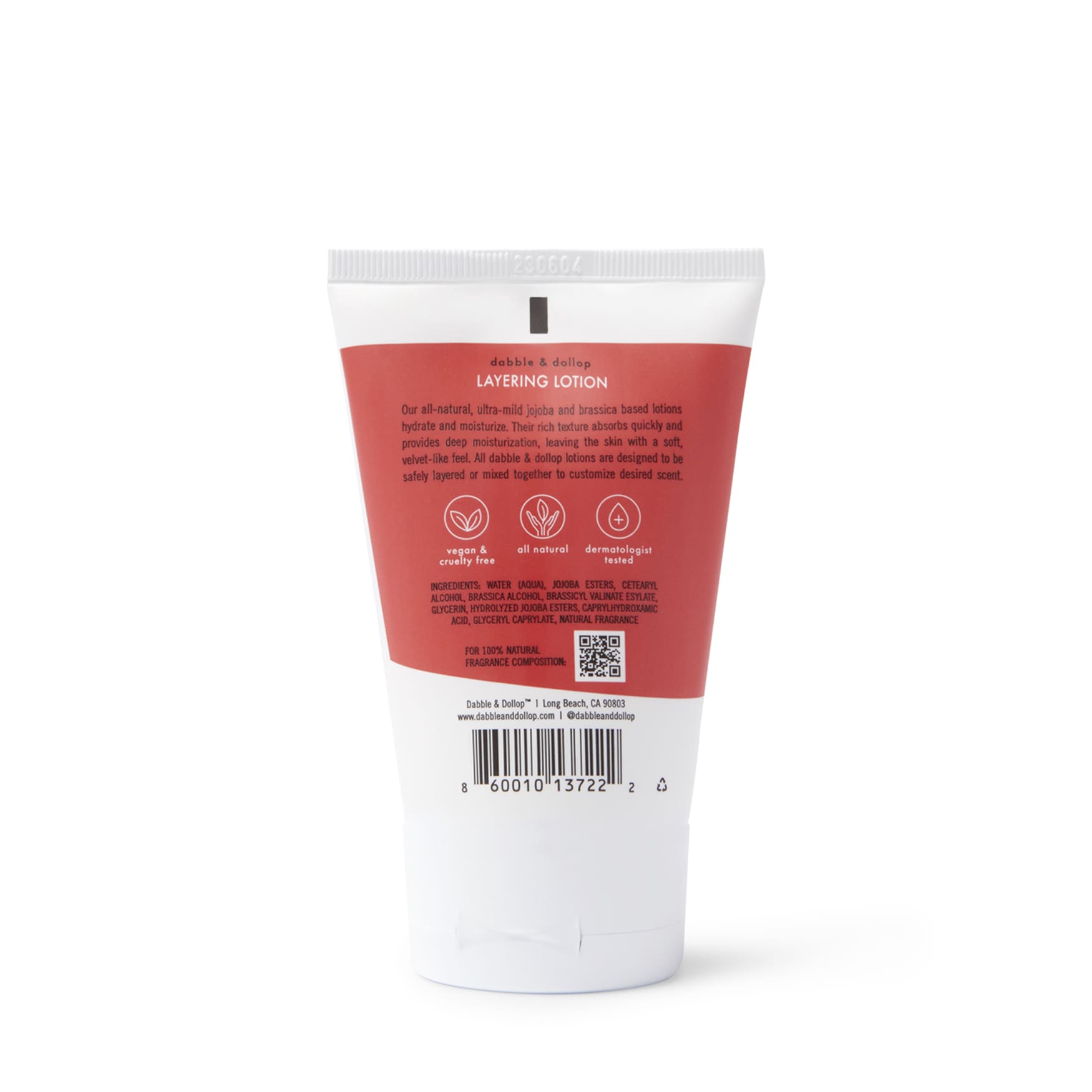 Dabble & Dollop's layering lotion tube advertises its all-natural, ultra-mild jojoba and brassica-based formula for deep moisturization.
