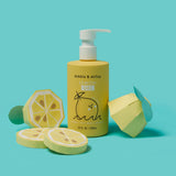 Dabble & Dollop displays its Lemon Gel body wash and shampoo next to papercraft lemon slices.
