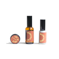 Showcase three URB.Apothecary skincare products: Pot of Gold balm, Lavender Milky Oat face oil, and Willow Cleanser.
