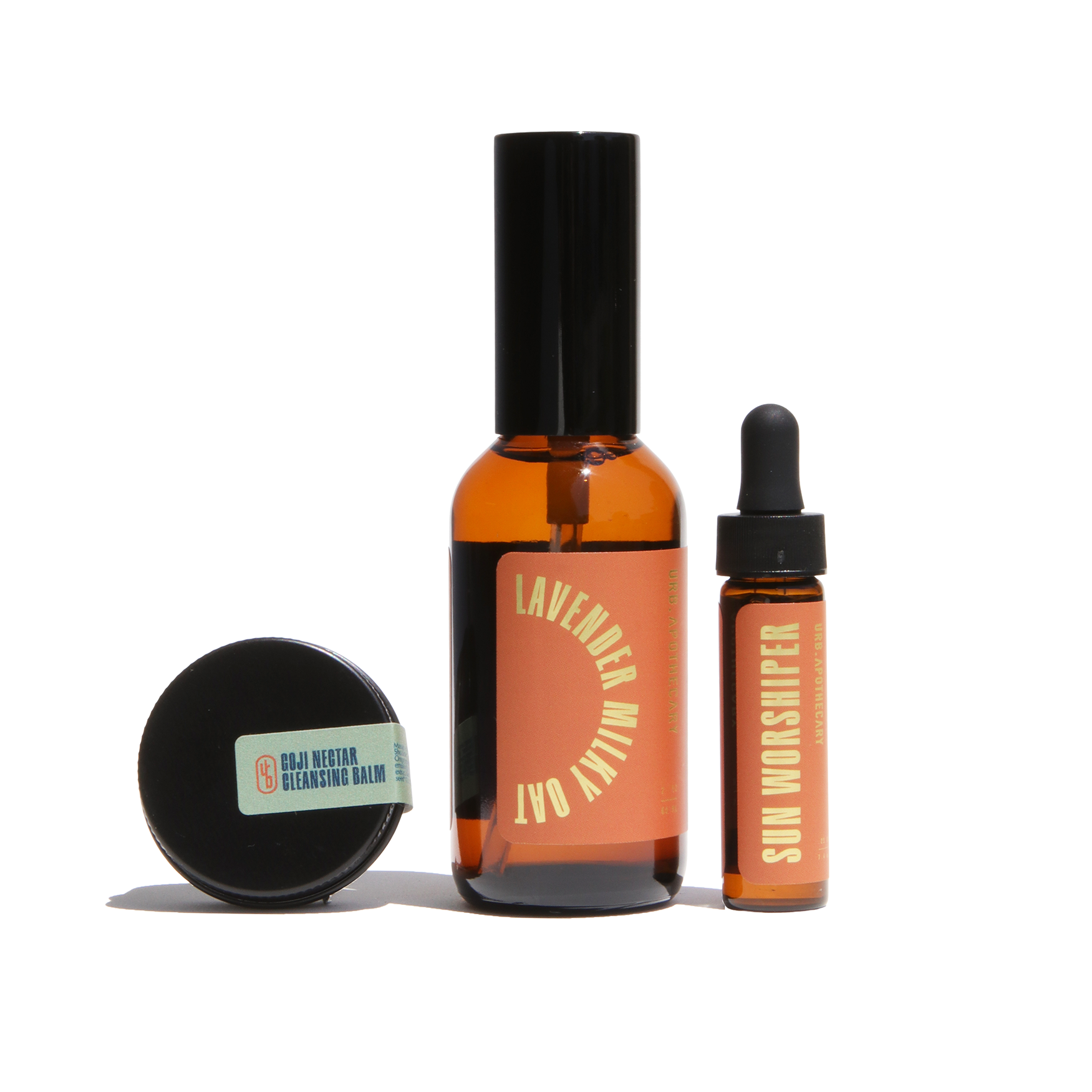 Showcases a collection of Urb Apothecary skincare products, including Lavender Milky Oat spray, Sun Worshiper serum, and Goji Nectar Cleansing Balm.
