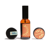 Display showcases Urb Apothecary skincare products, including Sweetgrass facial oil, Goji Nectar cleansing balm, and Pot of Gold balm.
