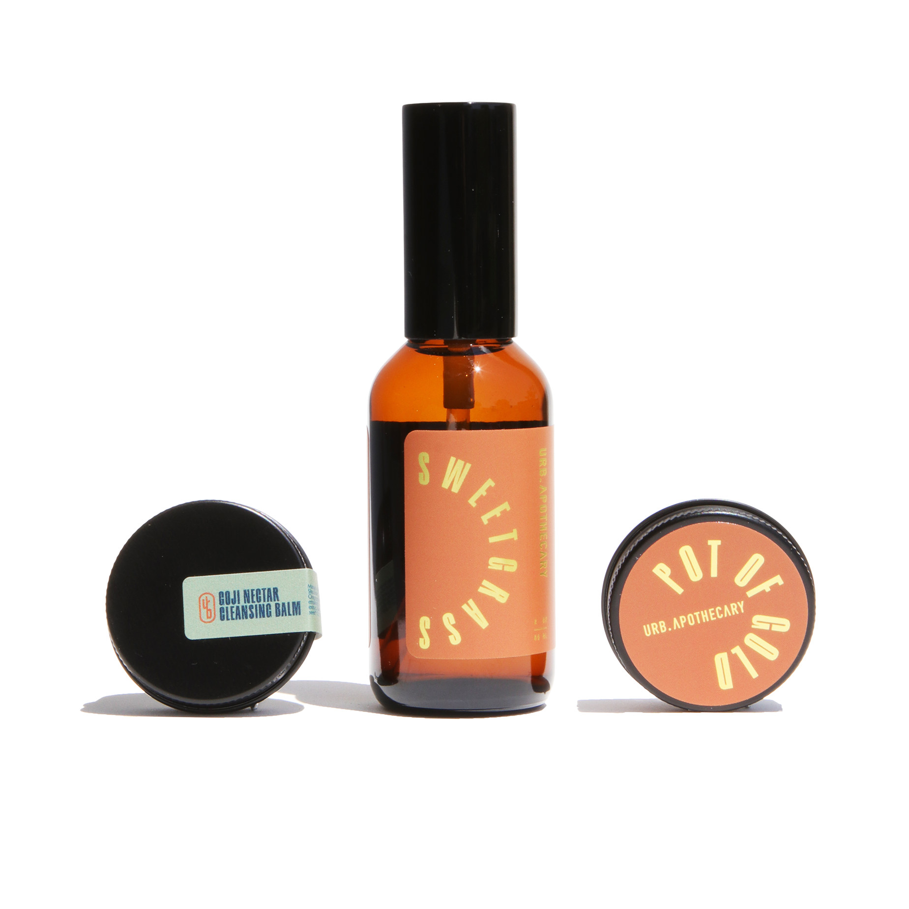 Display showcases Urb Apothecary skincare products, including Sweetgrass facial oil, Goji Nectar cleansing balm, and Pot of Gold balm.
