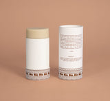 VanMan deodorant balm in an open paper tube displays its natural ingredients and sustainable company philosophy.

